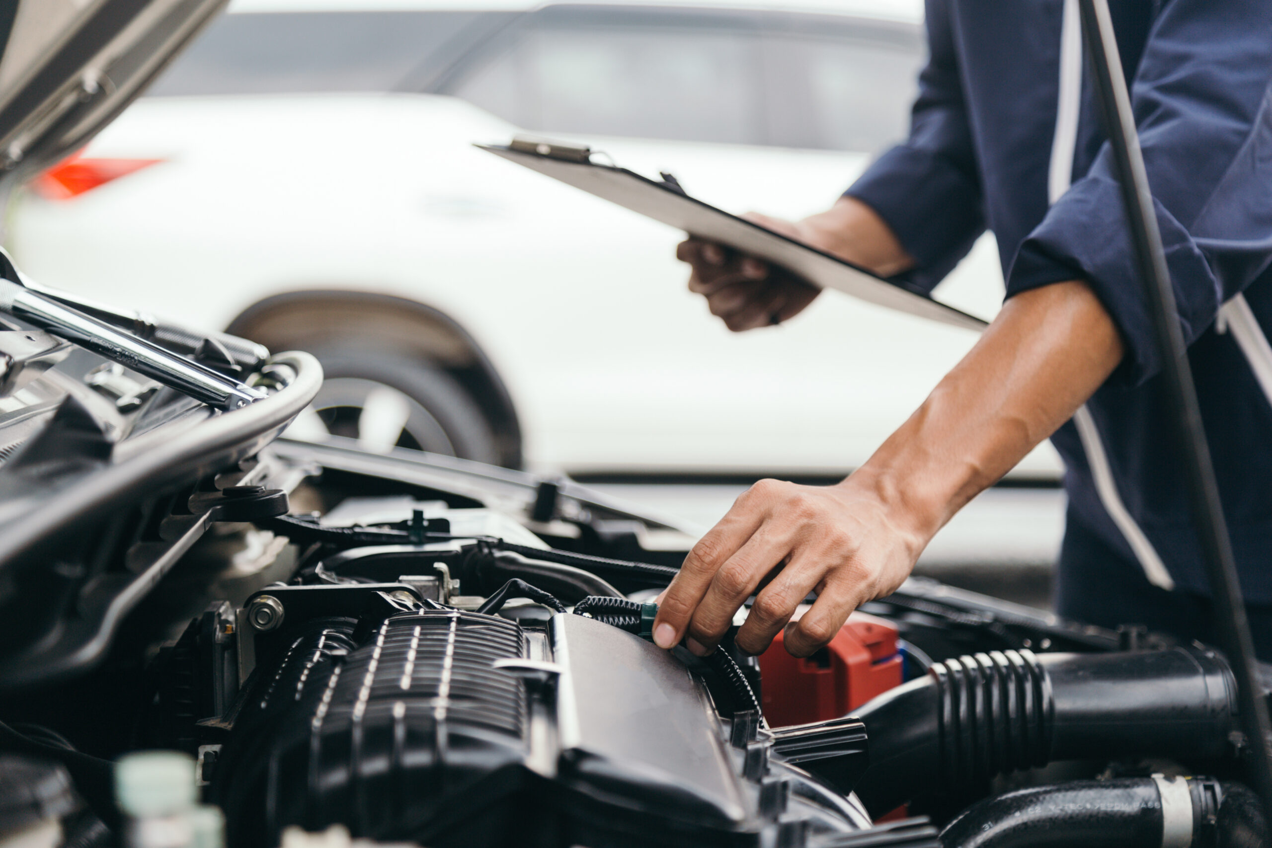 Automobile mechanic repairman hands repairing a car engine automotive workshop with a wrench, car service and maintenance,Repair service.